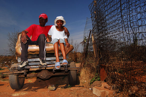 Chiawelo in Soweto: John Nekhumbe and Raylene Magoro sit in his 'donkey cart'