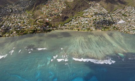 An aerial view of the coastline along Hawaii Kai on the Hawaiian Island of Oahu where organic sediment is one of the major threat to the reef. Photograph: Ed Darack / Corbis