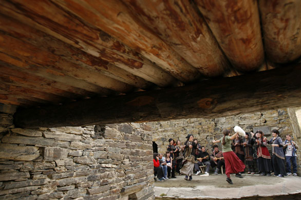 24 hours in pictures: Performers dance during the folk festival of Shatiloba