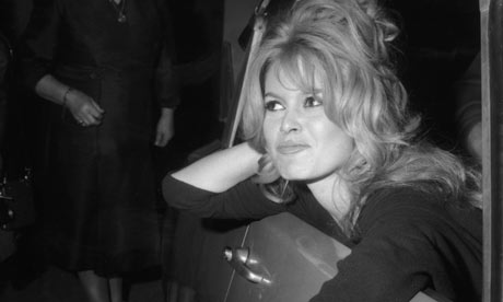 Brigitte Bardot faces the photographers at a film party in 1960
