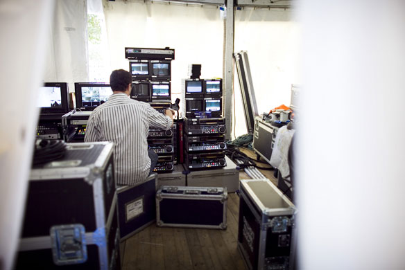 The Burberry Show: A technician setting up behind the catwalk