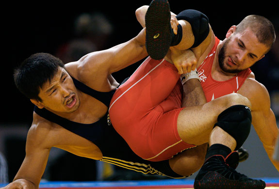 World Wrestling Champs: Trent Paulson attempts to wriggle free of Leonid Spiridonov's leg hold
