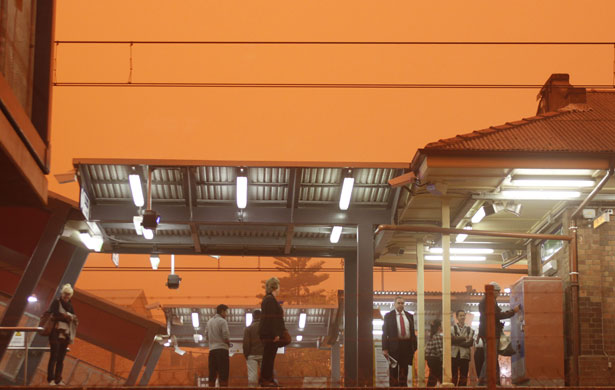 Sydney dust storm: People wait at a train station