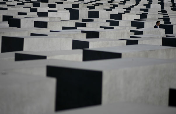 24 hours in pictures: Man walks through the Holocaust memorial in Berlin