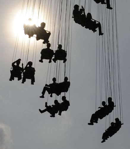 25 September 2009: Munich, Germany: Visitors sit in a carousel at the 176th Oktoberfest