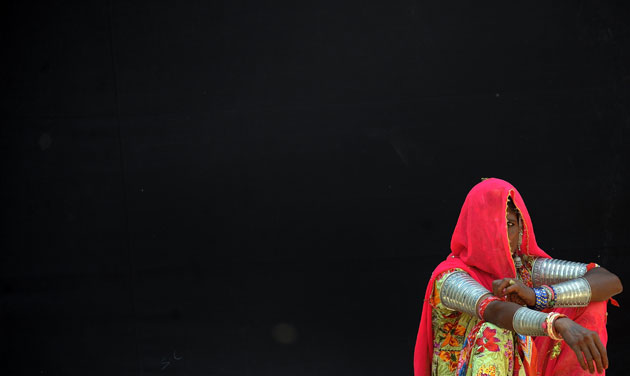 24 hours in pictures: Mirzapur, India: An Indian woman sits on the set of Eat Pray Love