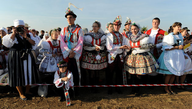 24 hours in pictures: Brno, Czech Republic: Pilgrims attend mass held by Pope Benedict XVI 