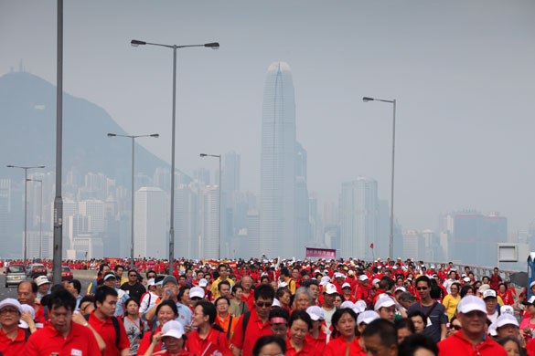 24 hours in pictures: Hong Kong, China: People take part in a charity walk 