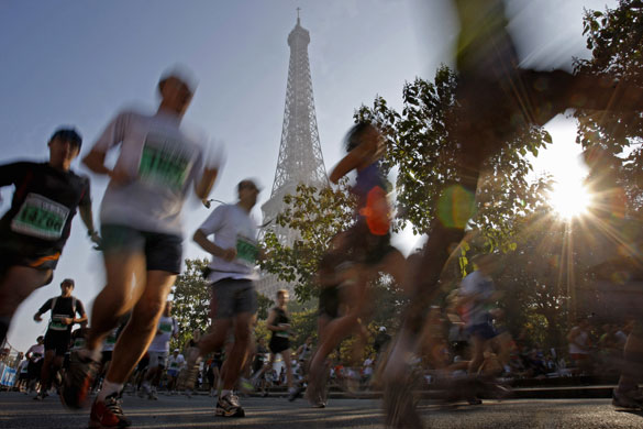24 hours in pictures: Paris, France: Competitors run at the start of the Paris-Versailles race