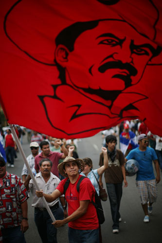 24 hours in pictures: Tegucigalpa, Honduras: Supporters of ousted President Manuel Zelaya march
