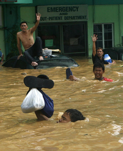 Philippines floods: Residents wait for evacuation from floods in Cainta Rizal, east of Manila