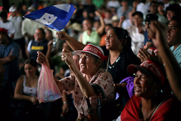 Honduras crisis: Supporters of Zelaya shout slogans near the coffin of Wendy Elizabeth Avila