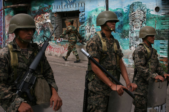 Honduras crisis: Soldiers stand guard outside the Brazilian embassy in Tegucigalpa