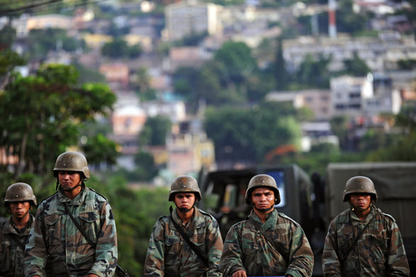 Honduras crisis: Honduran soldiers stand guard near the Brazilian Embassy in Tegucigalpa 