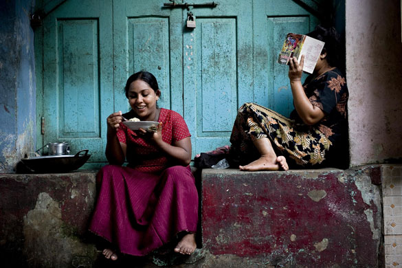 24 hours in pictures: Rangoon, Burma: women chat in the street 