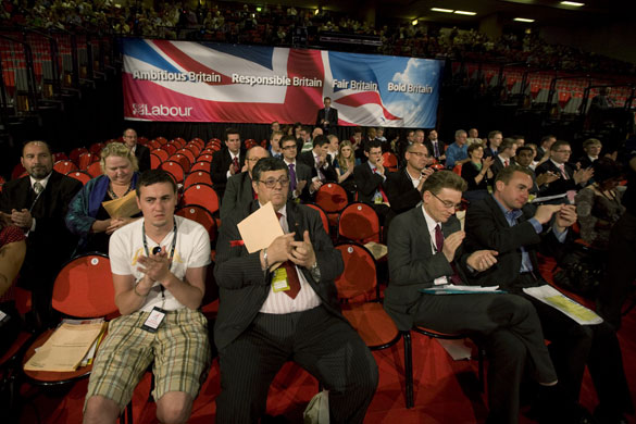 Labour party conference: Delegates applaud in front of a Labour banner