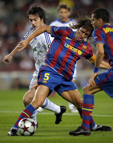Tuesday Champions League: Barcelona's captain Carles Puyol and Kiev's Artem Milevskiy