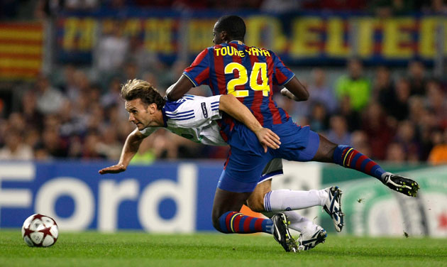Tuesday3 Champions League: Andriy Shevchenko and Barcelona's Yaya Toure collide