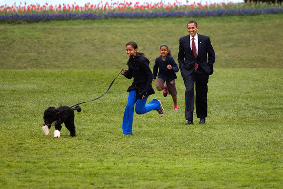 The Obama family: 14 April 2009: President Barack Obama with daughters Malia and Sasha and Bo