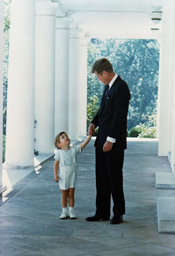 The Obama family: 1963: President John F Kennedy with his son John Jr outside the White House