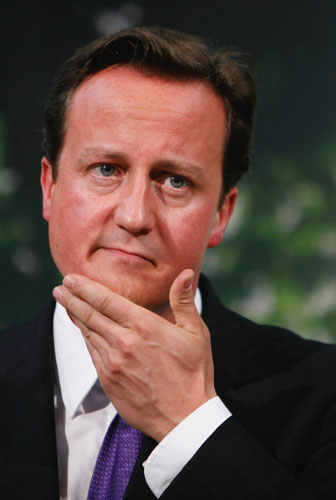 Sweating politicians: Conservative Party Leader David Cameron wipes his face during a speech