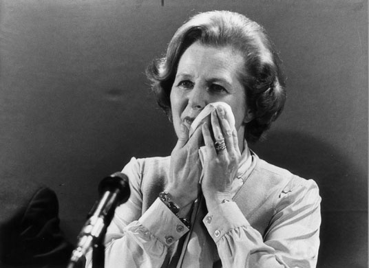 Sweating politicians: Margaret Thatcher wipes her face at a press conference