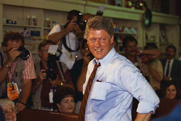 Sweating politicians: Bill Clinton meets with local people in Corsicana, Texas, on a hot day