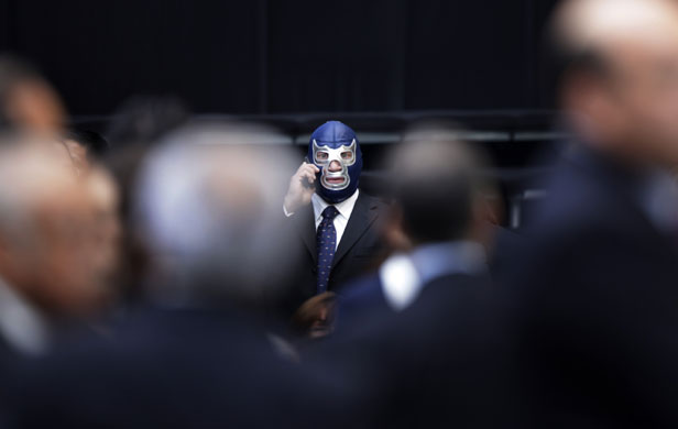 3 September 2009: Mexico City, Mexico: Wrestler Blue Demon speaks on a phone