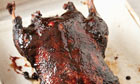 Aromatic braised and roasted whole duck with pancakes and garnish
