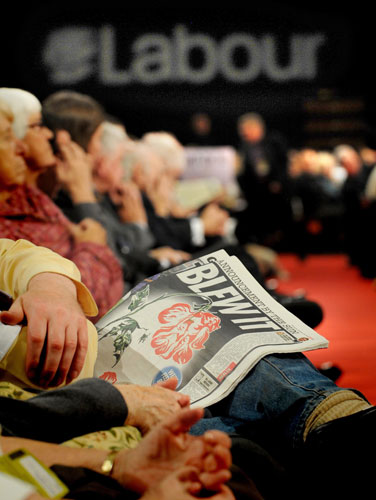 Labour conference day 4: A delegate reads The Sun newspaper at the Labour Party conference