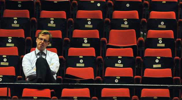 Labour conference day 4: A delegate watches a speech by Secretary of State for Health Andy Burnham