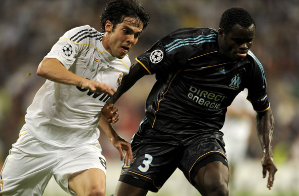 Wed3 Champions League: Real Madrid's Kaka attempts to go around Marseille's Taye Taiwo