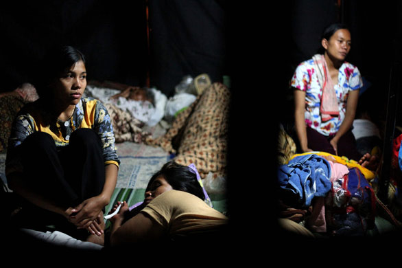4 September 2009: Tasikmalaya, Indonesia: Refugees rest in their camp following an earthquake