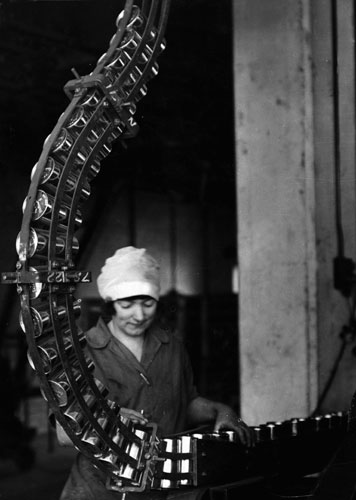 Cadbury's: Woman checking cans of cocoa on conveyor at cadbury's 1928 