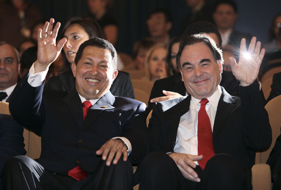 24 hours in pictures: Hugo Chavez and Oilver Stone at Venice Film Festival