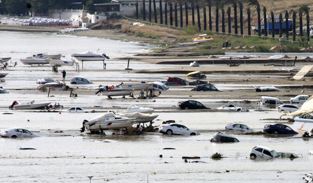 Flooding in Turkey: Partially submerged cars are seen next to boats after heavy rains