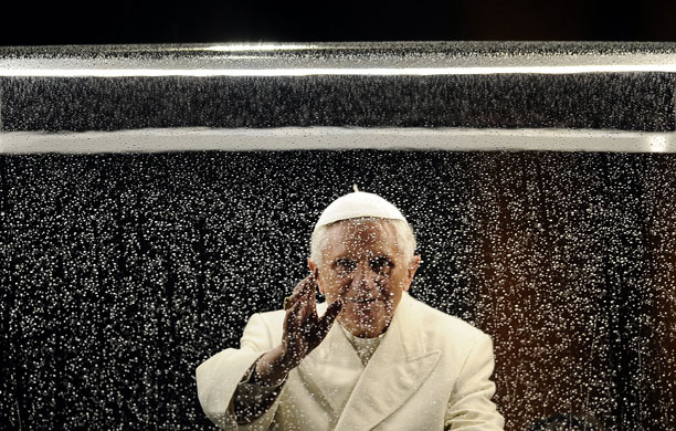 24 hours: Pope Benedict XVI blesses the faithfull from his popemobile
