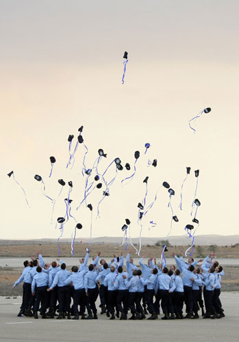 24 hours: Newly graduated Israeli pilots throw their caps into the air