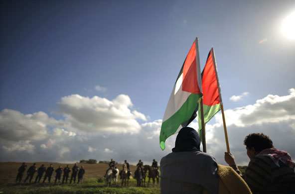 24 hours: Israeli Arab demonstrators hold Palestinian flags  