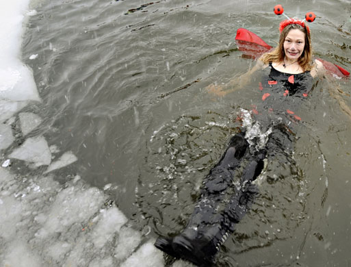 24 hours in pictures: Berlin, Germany: A member of a winter bathing association