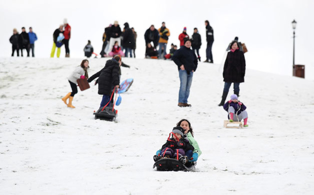 Cold weather continues: 10 January, London, UK: People sledging on Primrose Hill