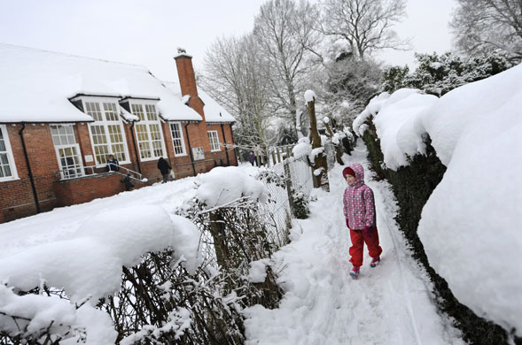 snow update: A young girl makes her way to school in the snow in Hampshire
