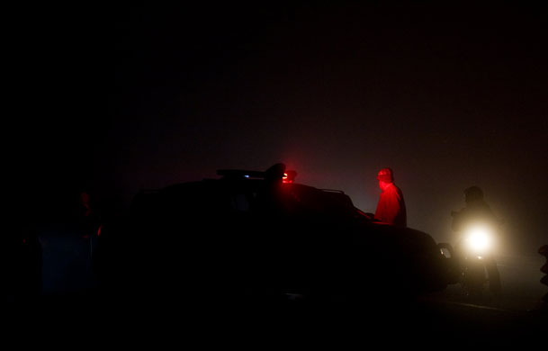 24 hours in pictures: Mexico City,Mexico: Police guard the site of a helicopter crash 