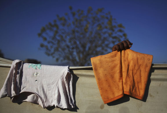 24 hours in pictures: Islamabad, Pakistan A girl collects her laundry in a slum area