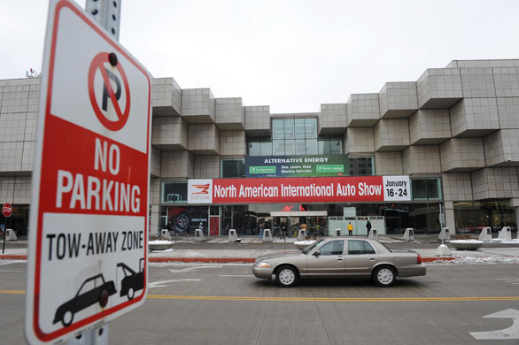Detroit motor show: A car drives past the entrance of the 2010 North American Auto Show