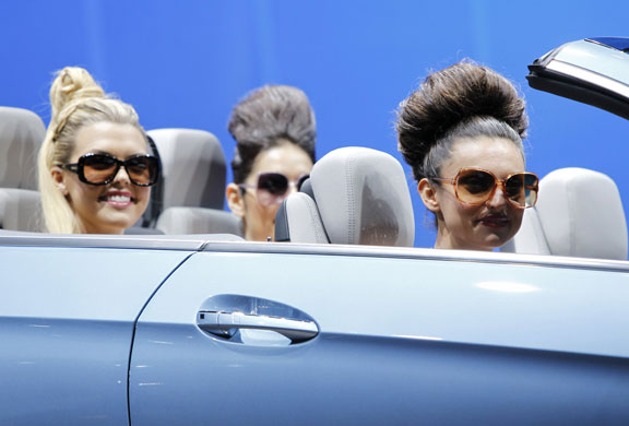 Detroit motor show: Models sit in the new Mercedes-Benz E350 convertible