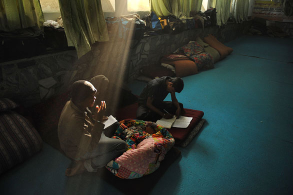 24 hours in pictures: Kabul, Afghanistan: Indian migrant workers relax at a Sikh Gurdwara