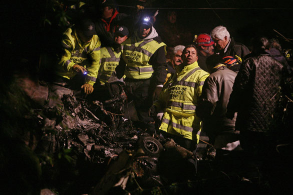 24 hours in pictures: Cuajimalpa, Mexico: Police officers and rescue workers look for bodies