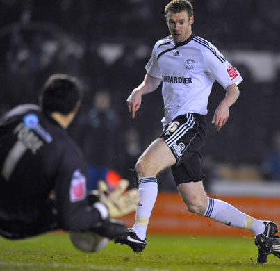 FA Cup 3rd Round: Millwall goalkeeper David Forde blocks Derby's Stephen Pearson shot at goal
