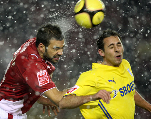 FA Cup 3rd Round: Bristol's Liam Fontaine beats Cardiff's Michael Chopra to the ball 